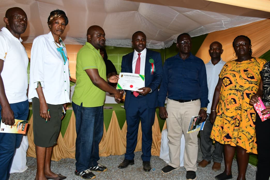 Tribunal secretariat receive a certificate of participation from officials of the County Government of Kakamega during the National Agricultural Show in the county