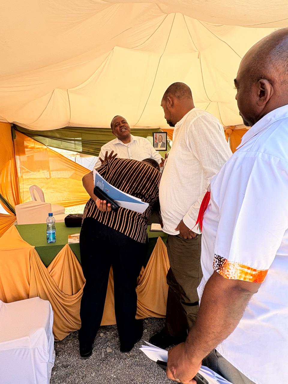 The Tribunal CEO Mr Julius Mutua engaging the Kenya Sugar Board Deputy Director Fund Management,Mr Daniel Onyango and  Mr Henry Nyagah,the Mombasa Agricultural Show chairman during their visit to the Tribunal's stand