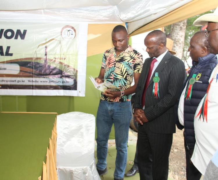 Dr. Wilson Tonui,managing director of the Agricultural Development Corporation visits the Competition Tribunal exhibition stand during the Machakos National Agricultural Show to learn more about the Tribunal's mandate,functions and role in promoting fair competition and access to justice in Kenya
